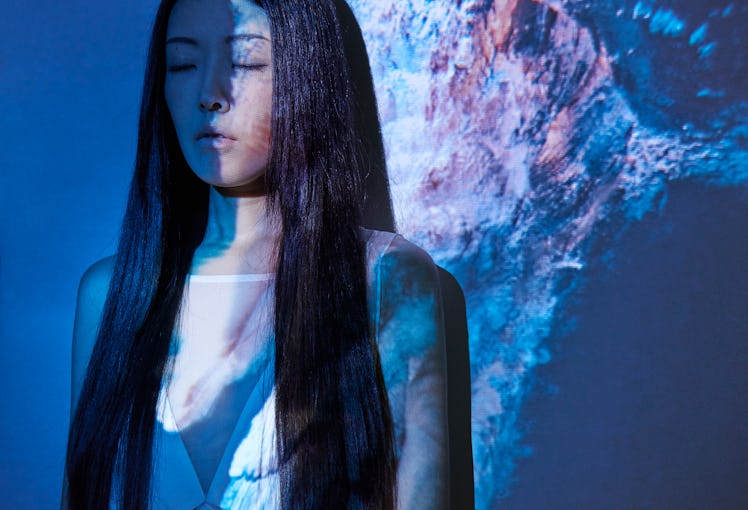 Young Asian woman, mystical Mercury retrograde